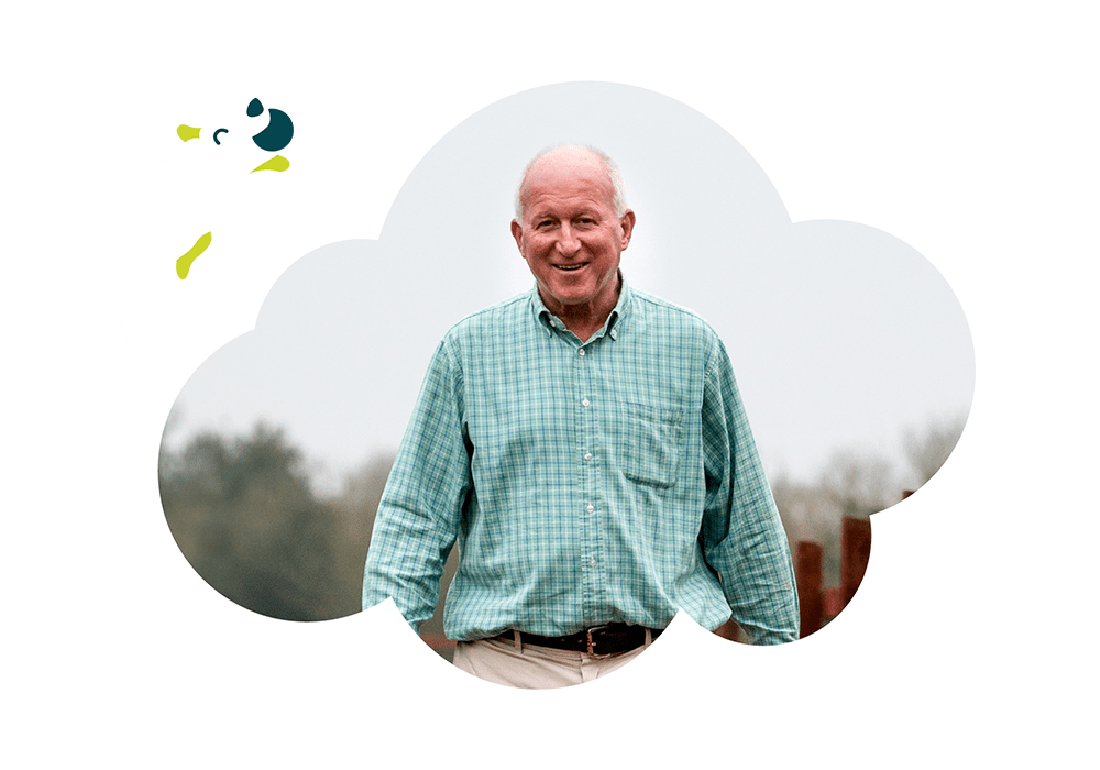 Dr Roger Mugford strolling through his farm